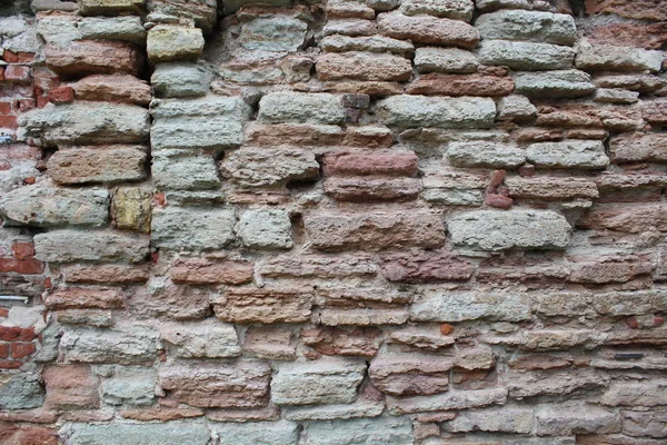 Mauerwerk, eine schöne Mauer. interessanter Steinhintergrund. — Stockfoto