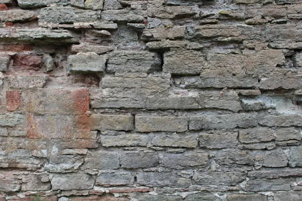 Metselwerk, een prachtige muur. Interessante stenen achtergrond. — Stockfoto