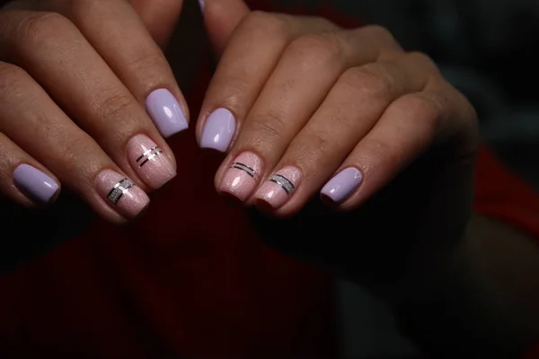 Manicure with long nails on a trendy texture background — Stock Photo, Image