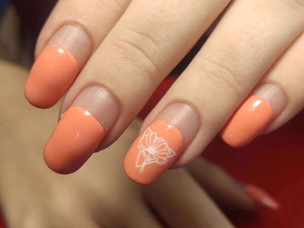 Female hand with regrowth shellac manicure in two months after application, need in correction