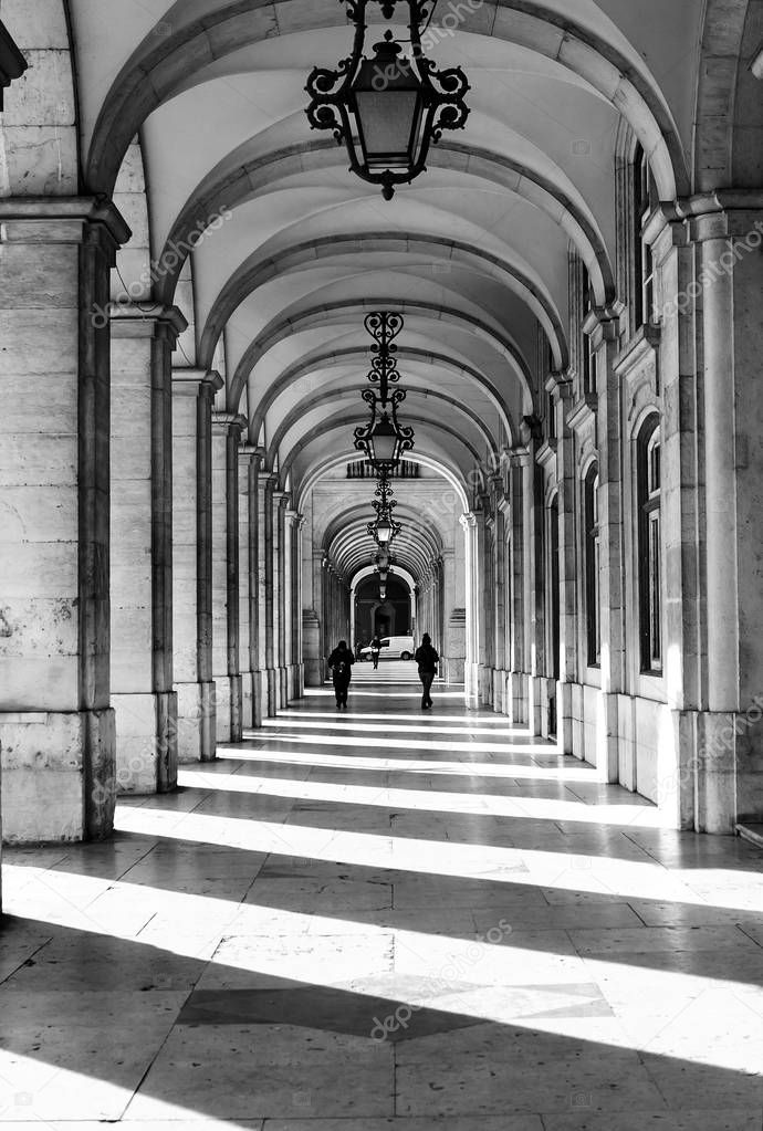 An image of a vault of arches from the outside of the building, in the street in the afternoon, Lisbon, Portugal 