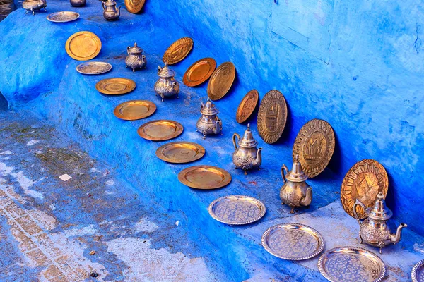 Colorful Moroccan fabrics and handmade souvenirs on the street in the blue city Chefchaouen, Morocco, Africa..