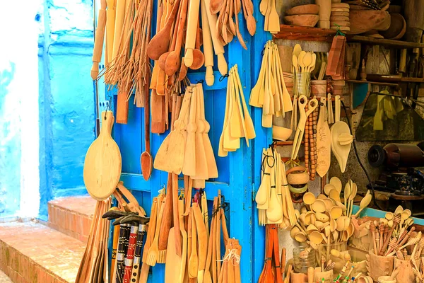 Colorful Moroccan fabrics and handmade souvenirs on the street in the blue city Chefchaouen, Morocco, Africa..