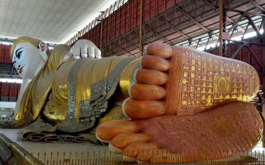 Reclining Buddha statue in Chauk Htat Gyi Pagoda. Yangon, Myanmar clipart