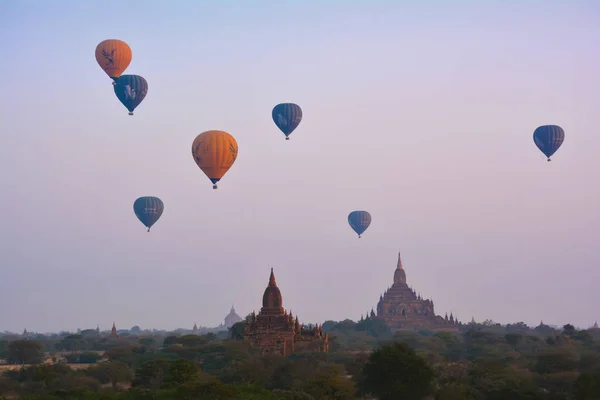 BAGAN, MYANMAR - FEBRUARY 18, 2016: Breathtaking flight on hot-air balloons over Bagan Archaeological Zone, Myanmar