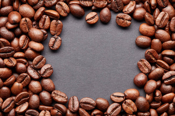 Roasted coffee beans with the table for text