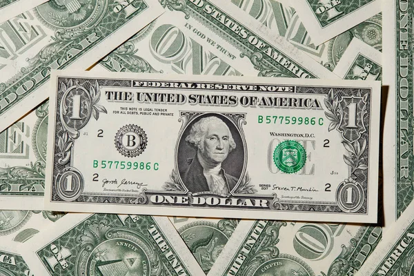 Een Achtergrond Met Amerikaanse Een Dollar Biljetten — Stockfoto