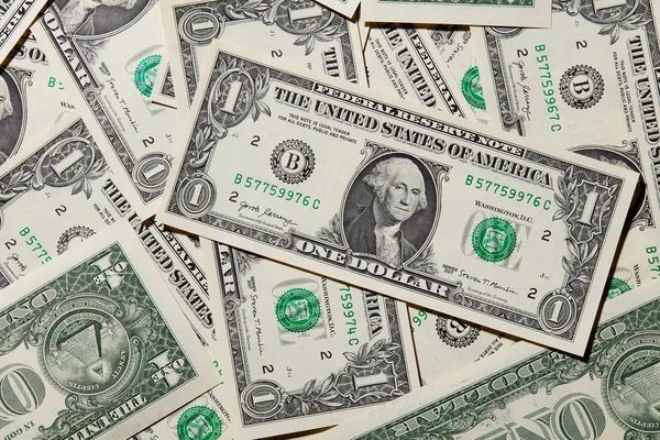 Een Achtergrond Met Amerikaanse Een Dollar Biljetten — Stockfoto