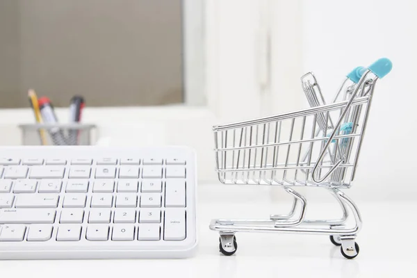 shopping online, desktop with shopping cart and computer keyboard