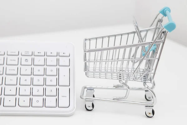 shopping online, desktop with shopping cart and computer keyboard