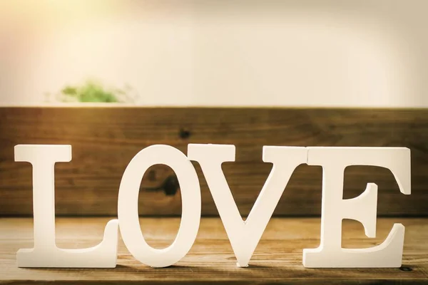 wooden letters with the word love, message and love concept