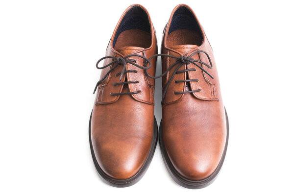 brown leather shoes insulated in white background