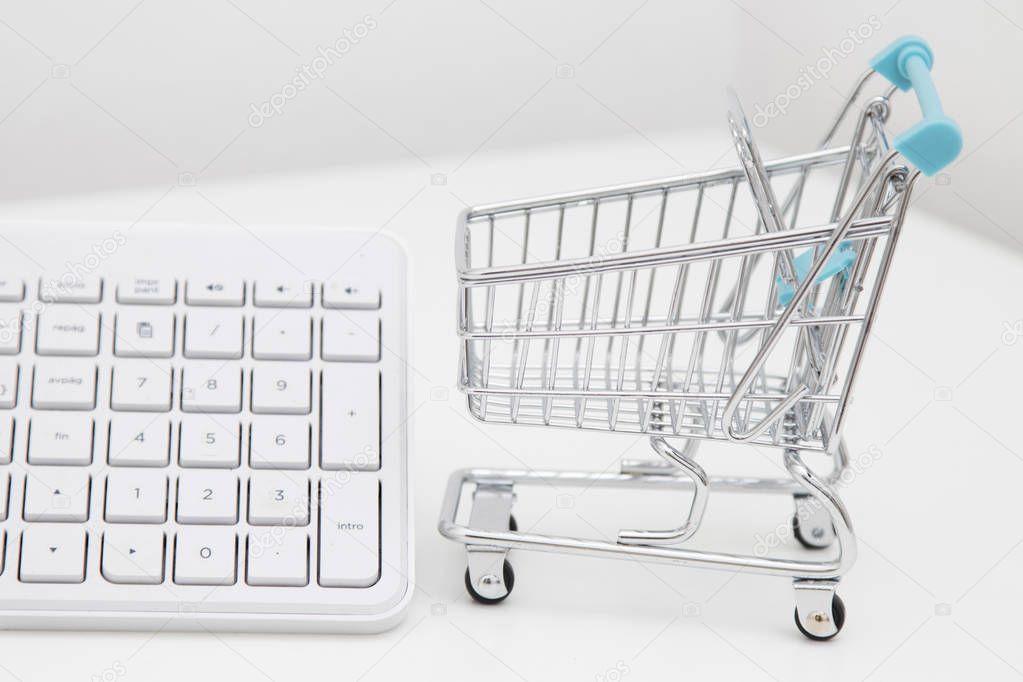 shopping online, desktop with shopping cart and computer keyboard