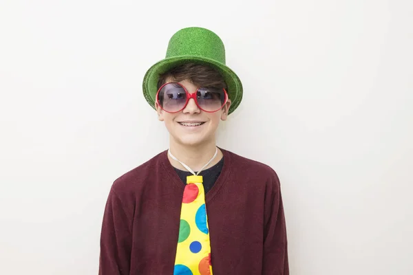 young man in clothes and carnival costume on white background