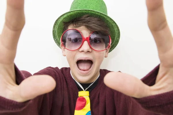 young man in clothes and carnival costume on white background