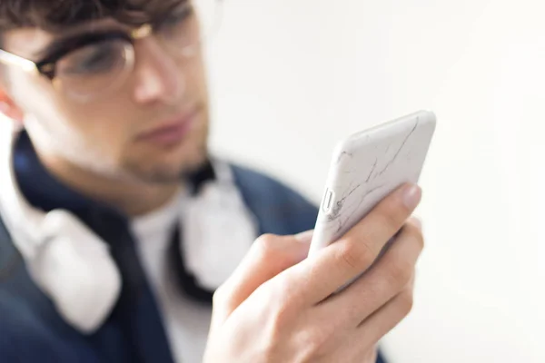 young man with earphones and mobile phone