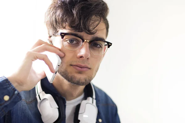 young man with earphones and mobile phone
