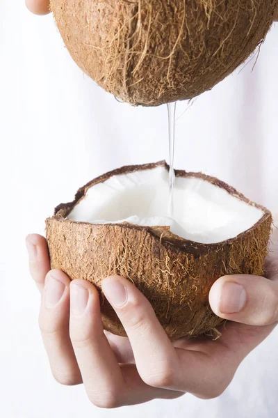 natural coconut milk in the hands
