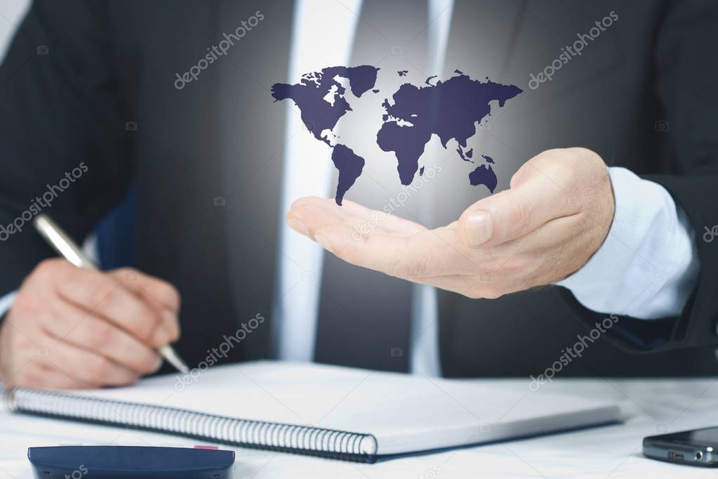 business man hand with the international map