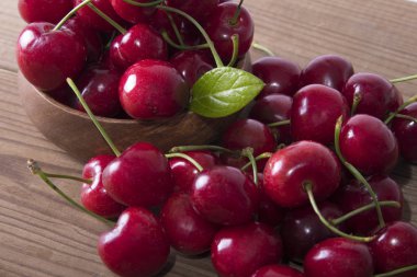 red cherries on rustic wood clipart
