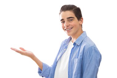 young teenager isolated in white pointing with space for text