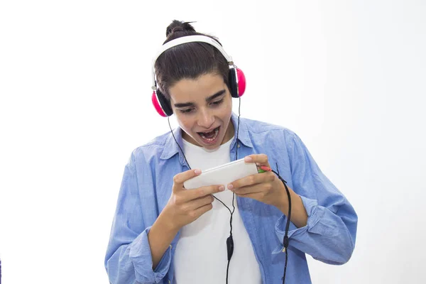 young teen amazed and expression of surprise with mobile phone and earphones