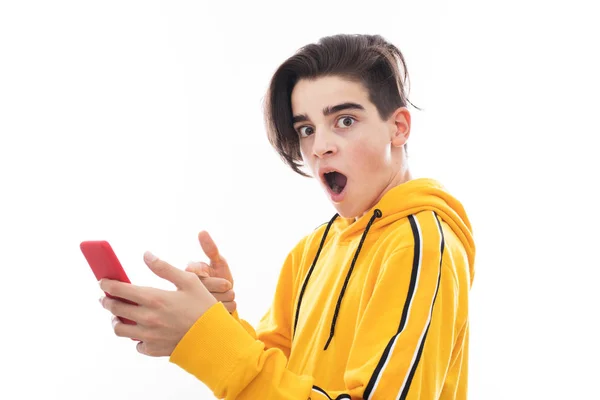 Adolescente Joven Con Teléfono Móvil Expresión Aislada — Foto de Stock