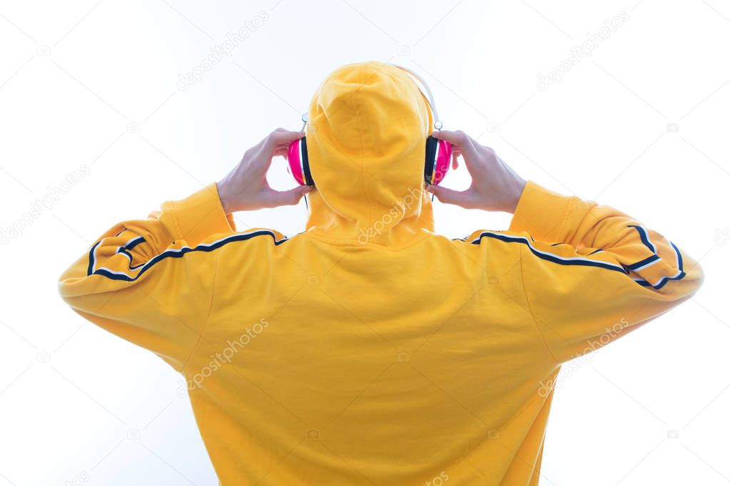 young listening to music with headphones