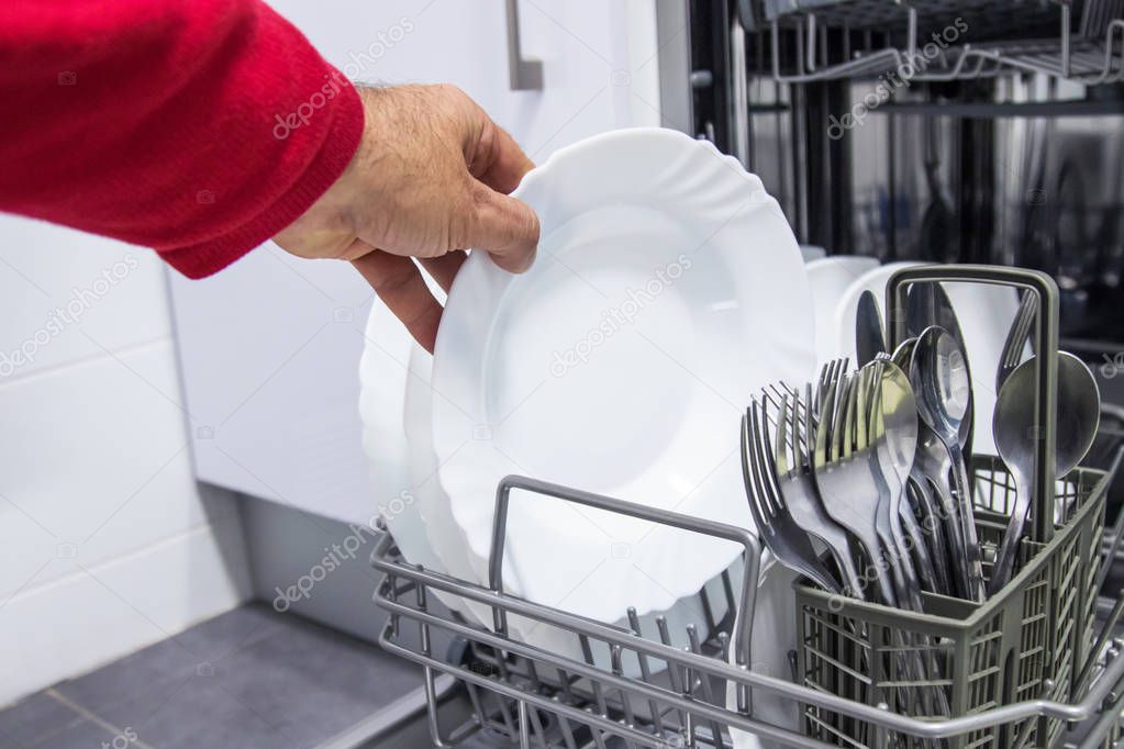 hand collecting dishwasher, household chores