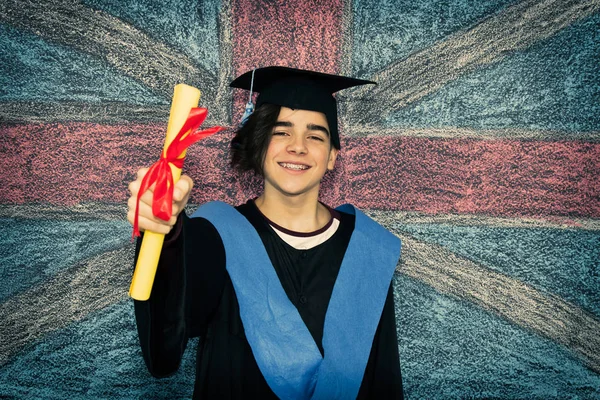 student with graduation uniform and background flag