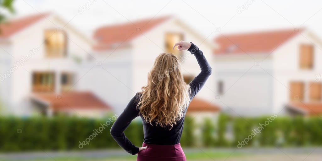 woman with an expression of doubt before the houses, buy house