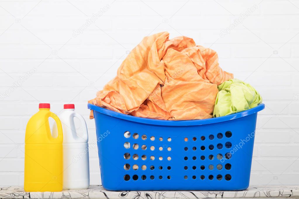 laundry basket with cleaning products