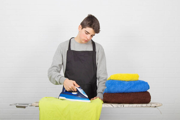 man ironing clothes, chores