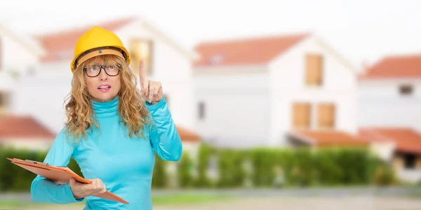woman building, architect or real estate with houses and buildings