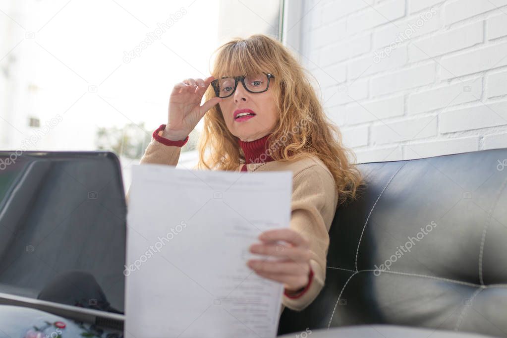 adult woman with document or invoice, businesswoman