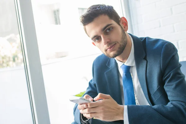 attractive business man with mobile phone