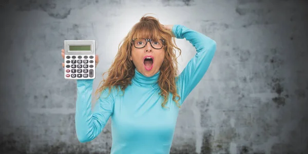 isolated adult woman with calculator and expression of surprise