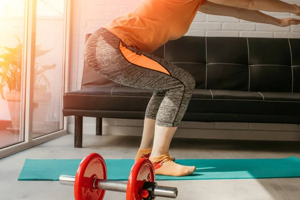 woman exercising at the gym or at home