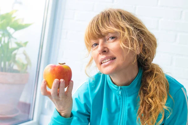woman athlete with apple, diet and sport