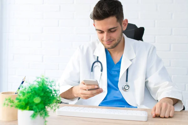 doctor with mobile phone in office