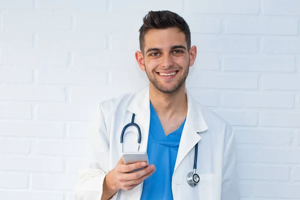 doctor with mobile phone and stethoscope