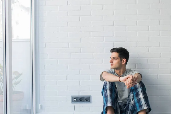 young man in pajamas in the morning at home or room