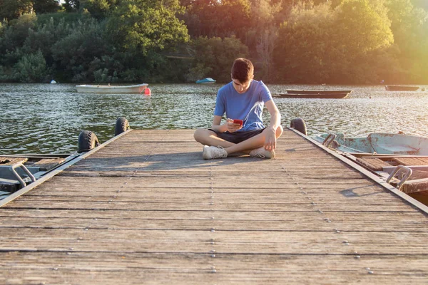 Young Man Mobile Phone Jetty Sunset — Stock Photo, Image