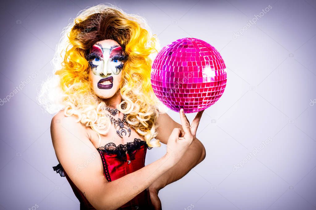 cool drag queen with spectacular makeup, glamorous stylish look, posing with   proud and  style for lgtb equality gay rights with disco ball