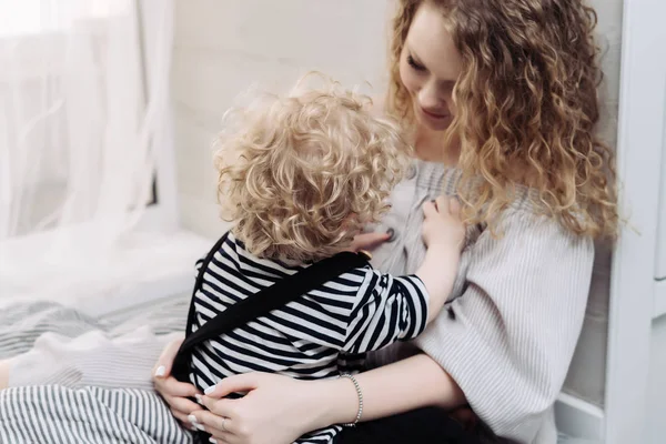 Friendly family, young curly mother playing with her young son, have fun — Stock Photo, Image