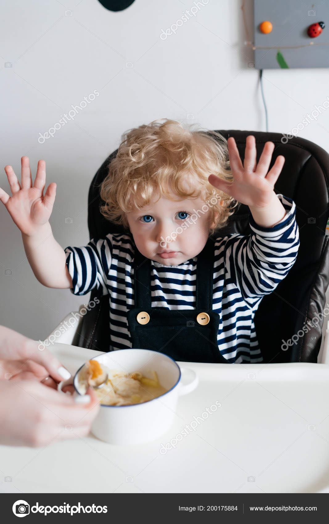 Cute Blue Eyed Curly Haired Child The Boy Is Sitting In The