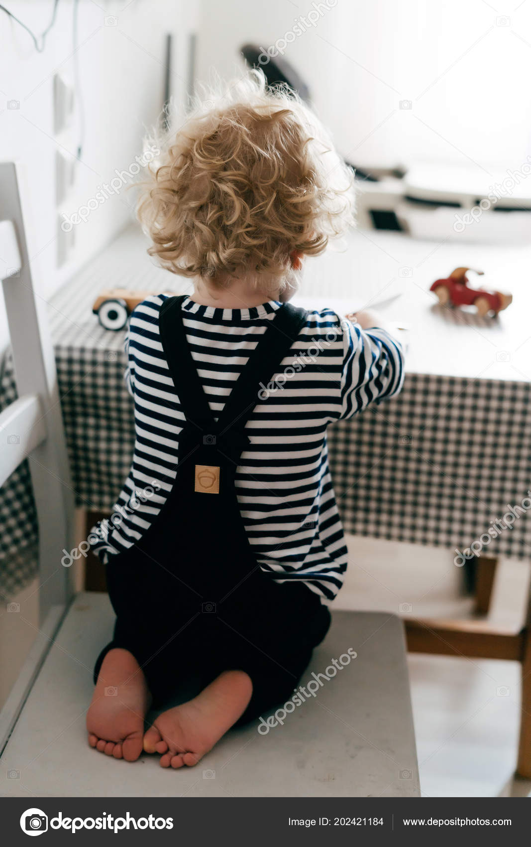 Cute Curly Blonde Baby Boy In Blue Pajamas Plays On The Bed Stock Photo,  Picture and Royalty Free Image. Image 103183694., image size:1067x1700
