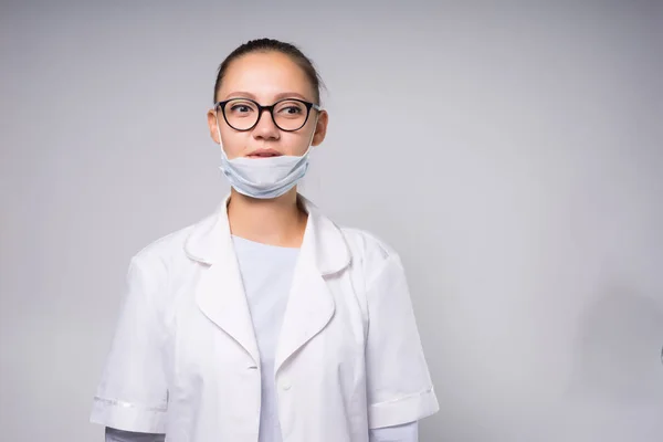 Girl nurse with glasses on white background — 스톡 사진