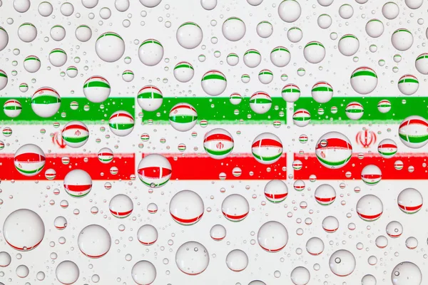 伊朗国旗背后的玻璃覆盖着雨滴 — 图库照片