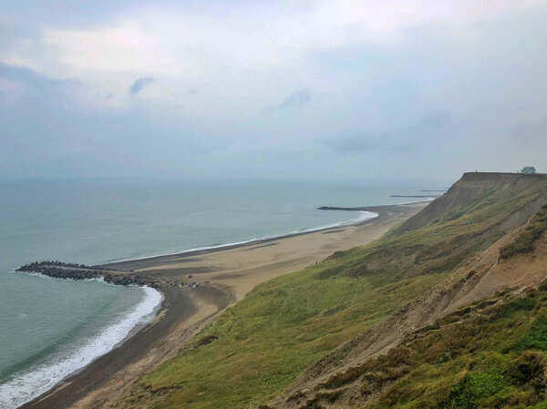 On the coast in Bovbjerg. Bovbjerg is a small village in Western Jutland, Denmark. It is known for its lighthouse, Bovbjerg Fyr and its beach, Bovbjerg Strand